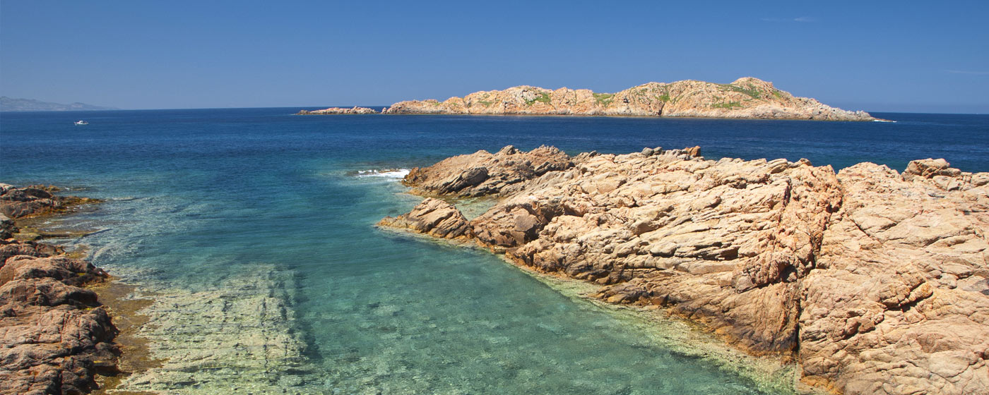 sardinian coast, between rocks and clear sea water